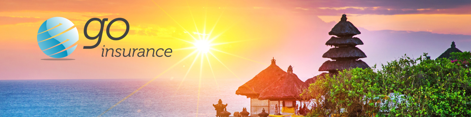 Sunset over a Balinese sea temple with tiered shrines, tropical gardens and the ocean